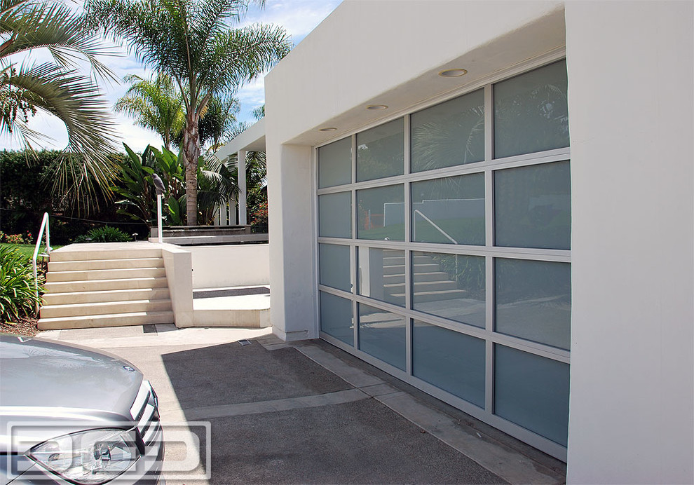 Inspiration for a large modern attached two-car carport remodel in Orange County