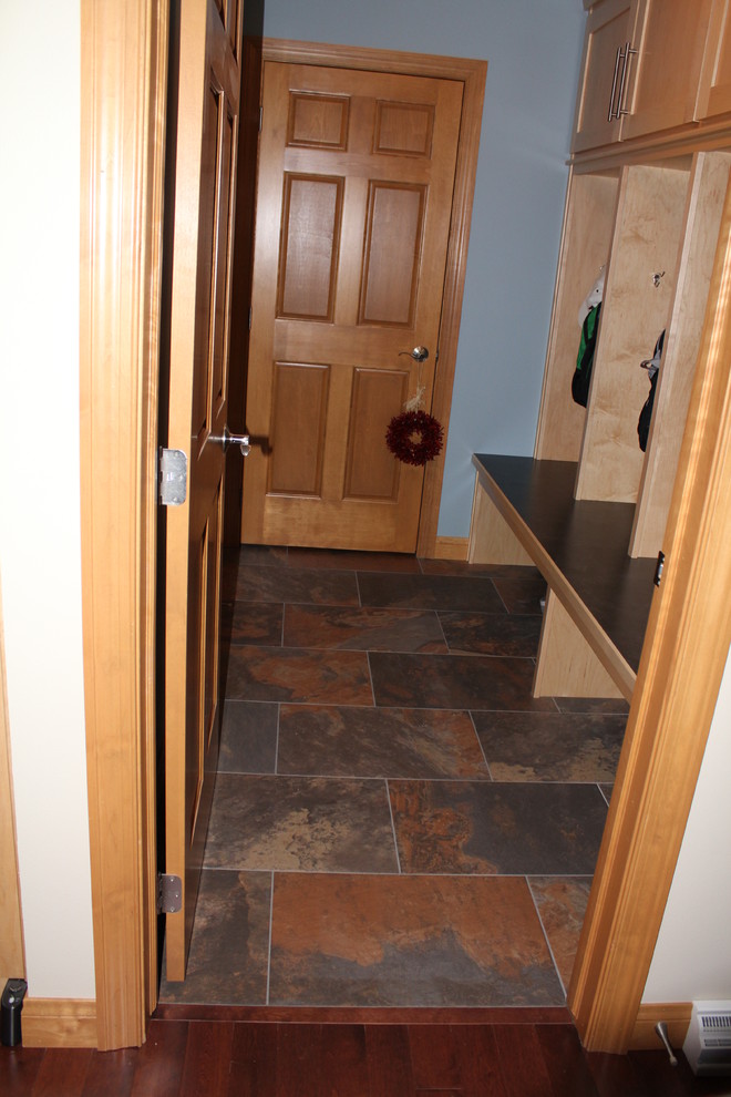 Mid-sized transitional porcelain tile mudroom photo