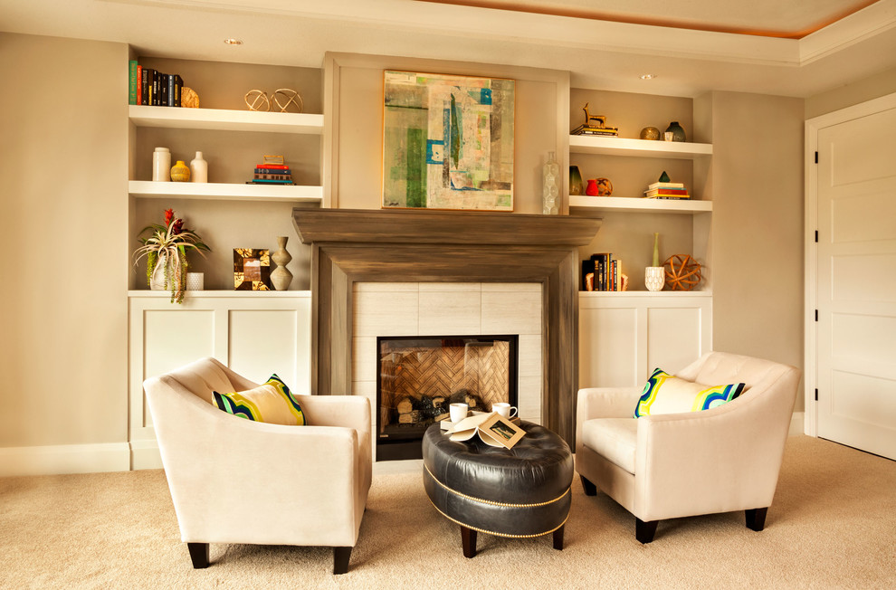This is an example of a transitional enclosed living room in Portland with beige walls and carpet.