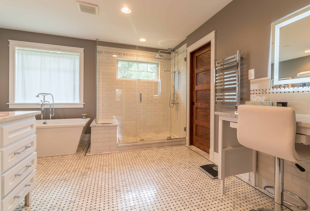 Photo of a mid-sized arts and crafts master bathroom in Chicago with shaker cabinets, white cabinets, a freestanding tub, a two-piece toilet, black and white tile, subway tile, grey walls, marble floors, an undermount sink, marble benchtops, white floor, a hinged shower door, white benchtops, an alcove shower, a shower seat, a double vanity, a freestanding vanity, wallpaper and wallpaper.