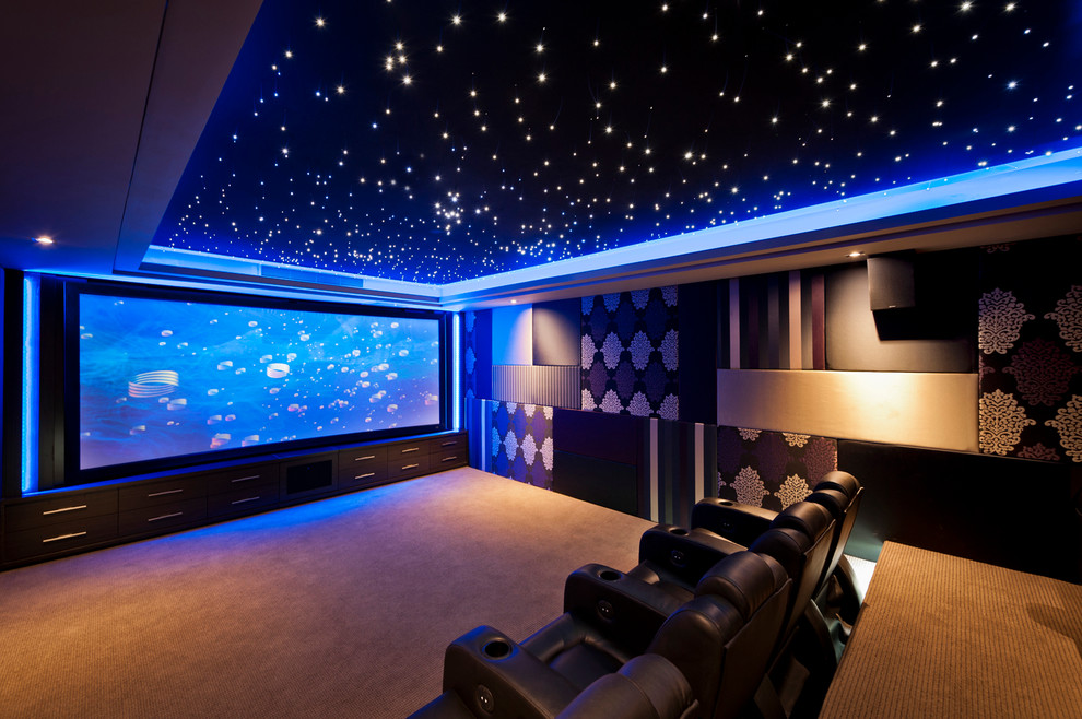 Design ideas for a large contemporary enclosed home theatre in Perth with multi-coloured walls, carpet and a built-in media wall.