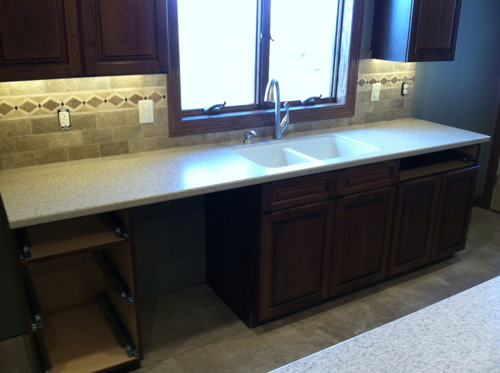Inspiration for a contemporary kitchen remodel with a double-bowl sink, beaded inset cabinets and dark wood cabinets