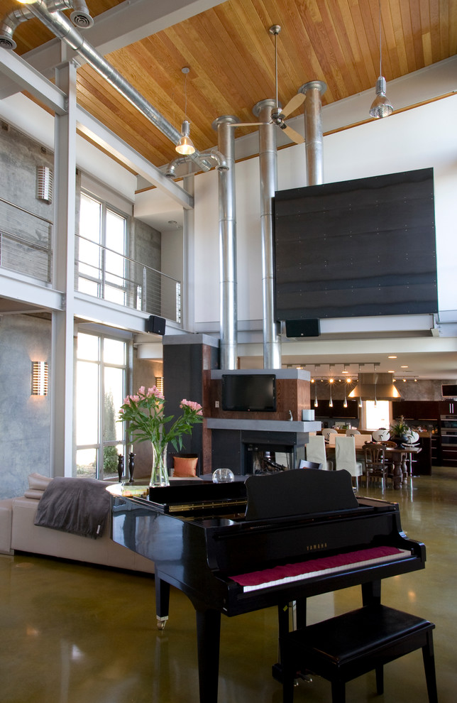 Inspiration for an industrial living room in Richmond with concrete floors.