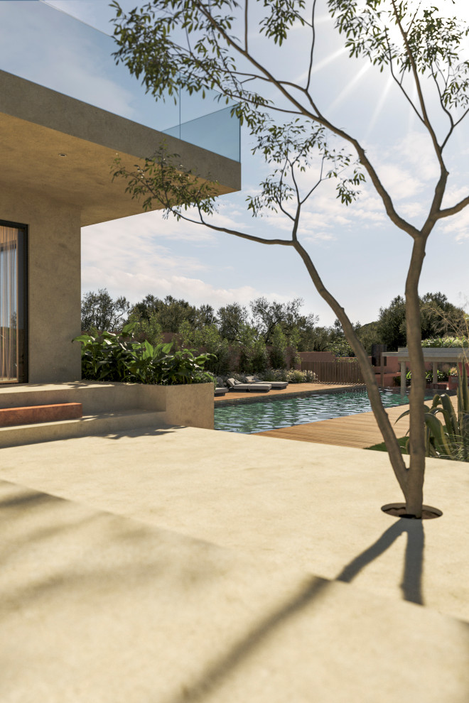 Idee per un grande giardino moderno esposto a mezz'ombra in cortile con pavimentazioni in pietra naturale