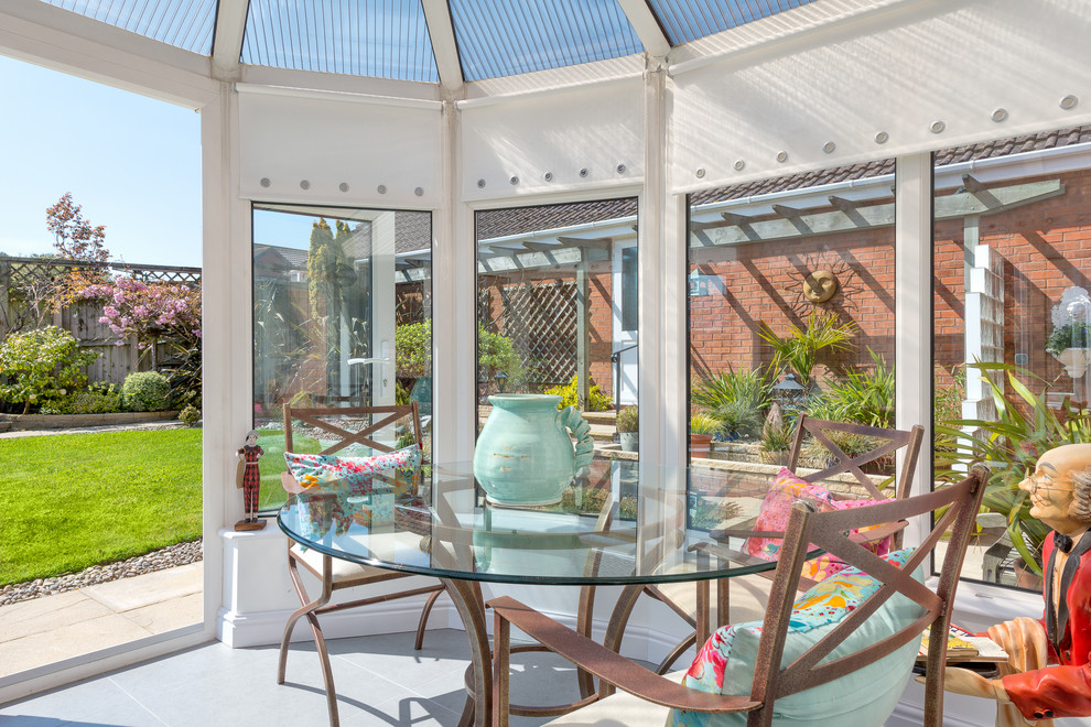 Photo of a small traditional sunroom in Devon with ceramic floors.