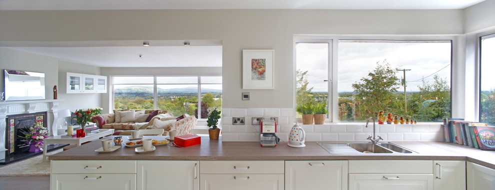 This is an example of a transitional kitchen in Limerick.