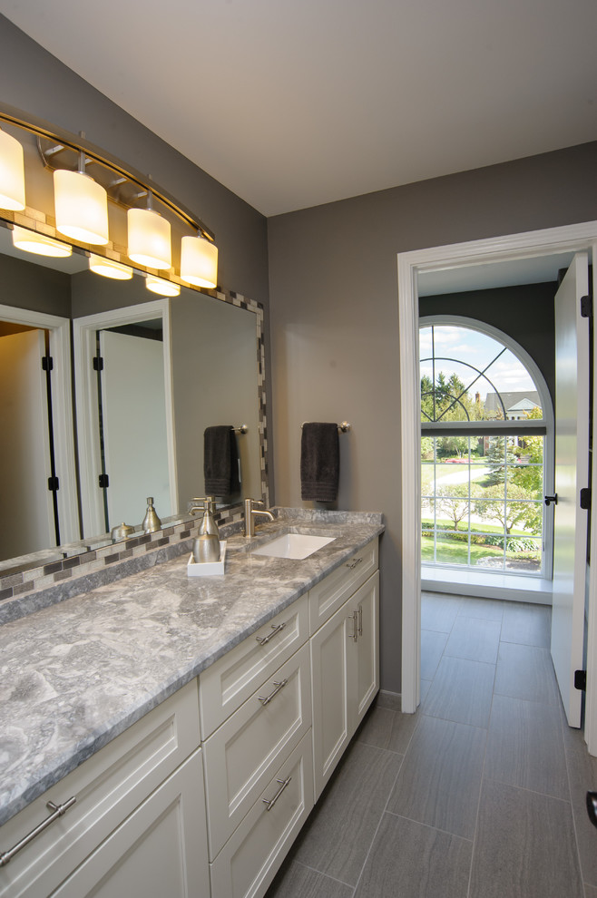 Large transitional kids bathroom in Detroit with a vessel sink, shaker cabinets, white cabinets, granite benchtops, a drop-in tub, an open shower, gray tile, glass tile, grey walls and ceramic floors.