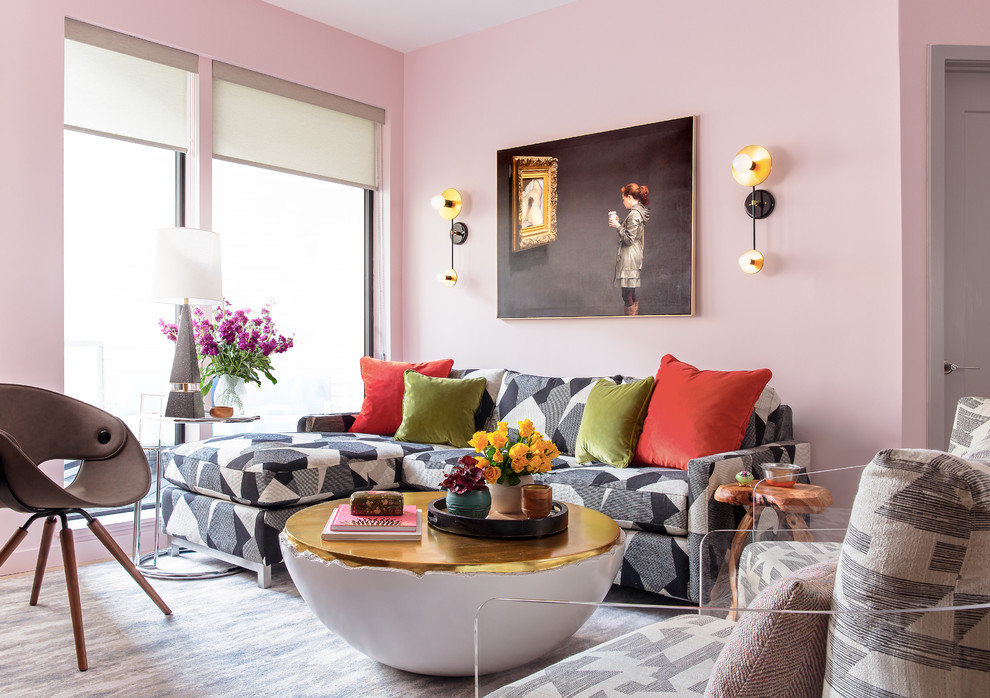 Inspiration for a mid-sized eclectic open concept living room in Boston with pink walls, carpet and no fireplace.