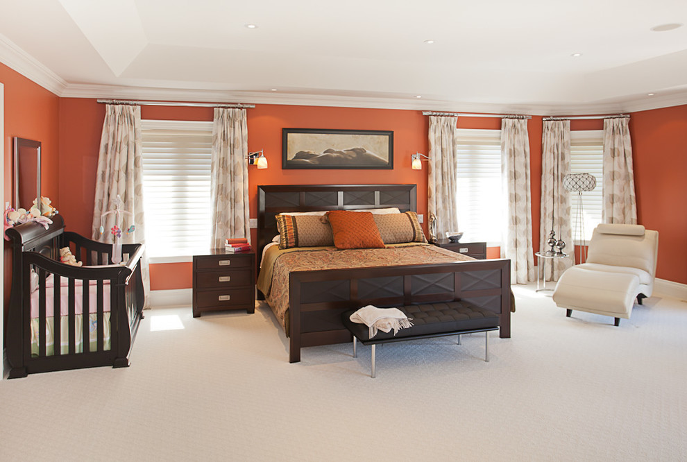 Photo of a mid-sized contemporary master bedroom in Toronto with red walls, carpet, no fireplace and white floor.