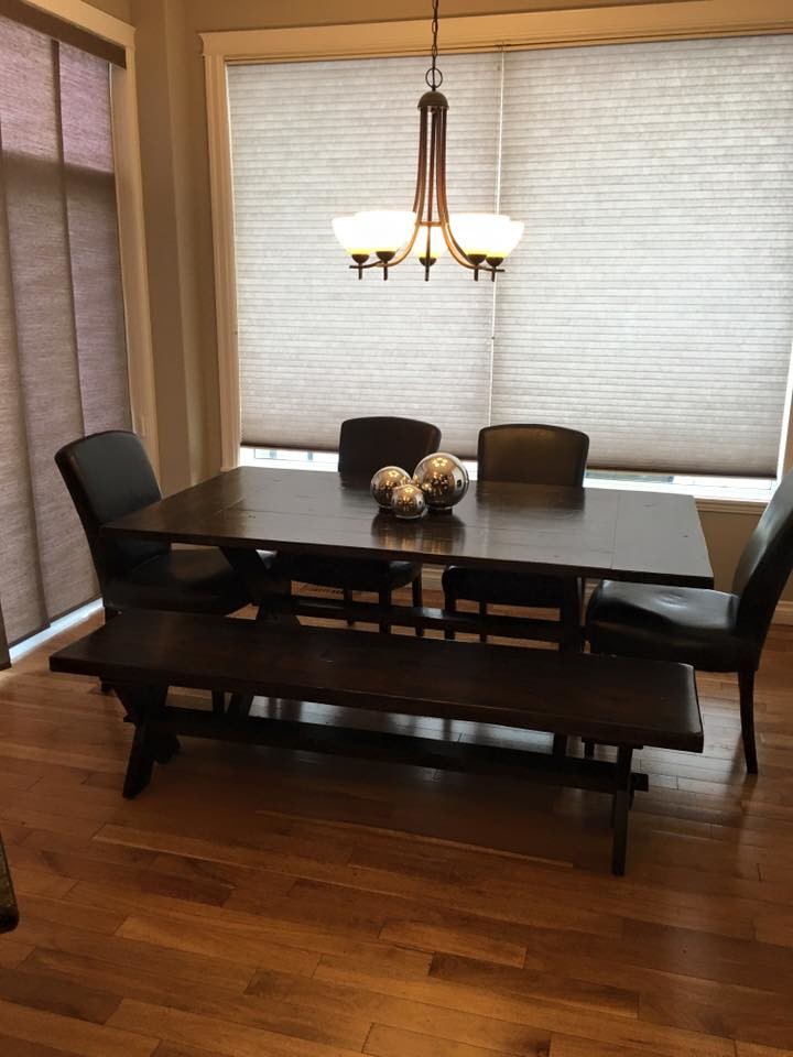 Mid-sized transitional medium tone wood floor dining room photo in Calgary with gray walls