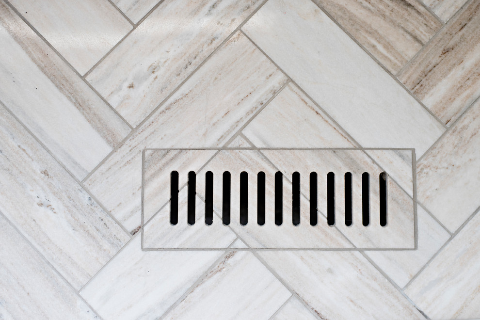 Inspiration for a mid-sized transitional master gray tile marble floor and gray floor bathroom remodel with shaker cabinets, gray cabinets, a one-piece toilet, gray walls, an undermount sink and quartzite countertops