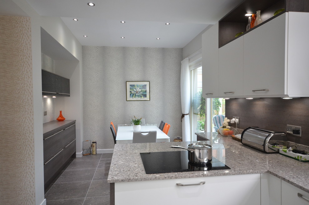 Medium sized contemporary u-shaped kitchen/diner in Glasgow with a double-bowl sink, open cabinets, grey cabinets, granite worktops, grey splashback, marble splashback, coloured appliances, medium hardwood flooring, no island and brown floors.
