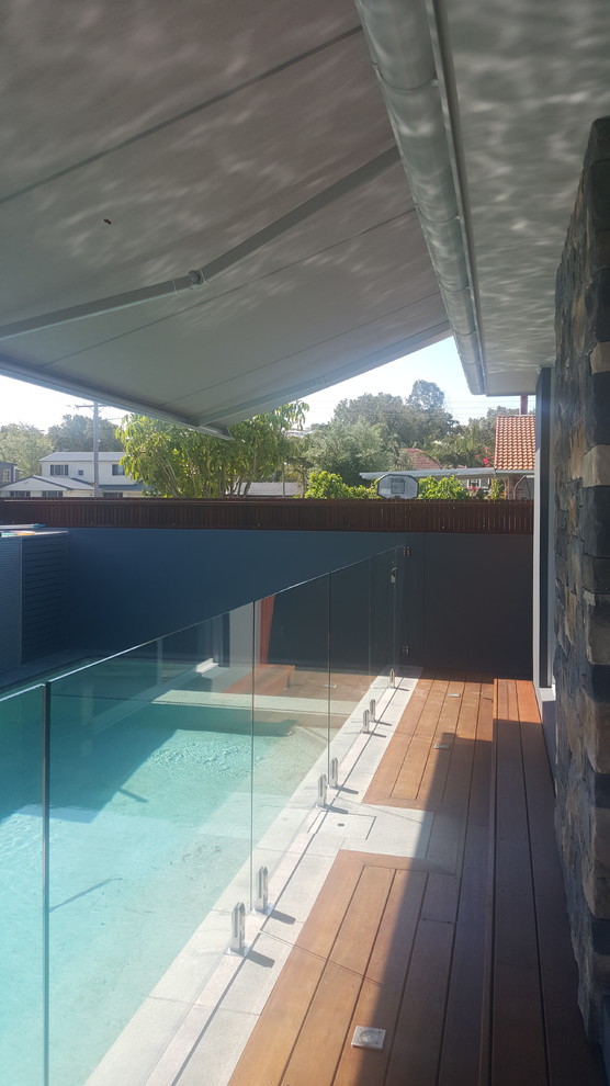 Inspiration for a small beach style rectangular lap pool in Central Coast with decking.