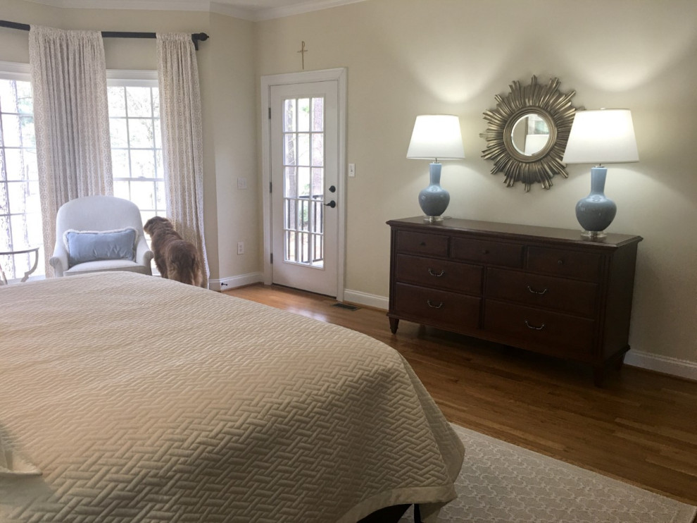 Mid-sized transitional master bedroom in Atlanta with white walls and light hardwood floors.