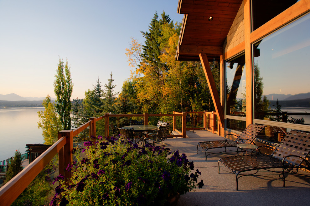 Inspiration for a country balcony in Vancouver with a roof extension.
