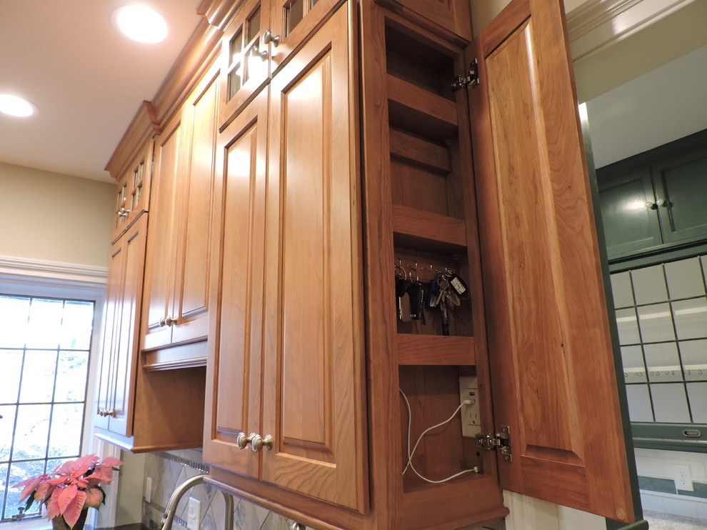 Traditional kitchen in Bridgeport with raised-panel cabinets, brown cabinets, light hardwood floors and beige floor.