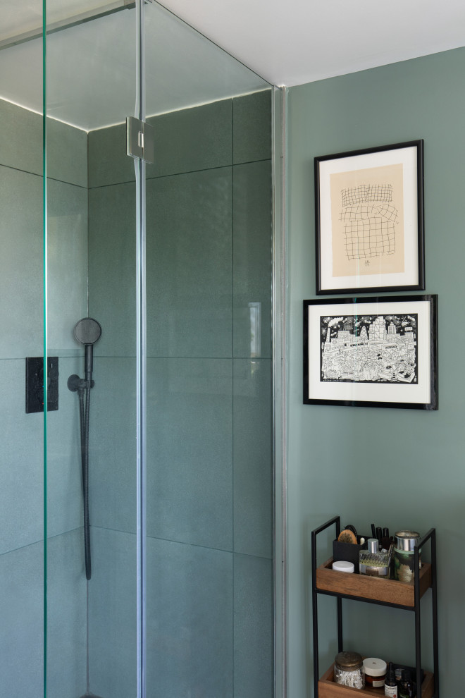 Small trendy master green tile and ceramic tile ceramic tile, gray floor and single-sink alcove shower photo in London with furniture-like cabinets, medium tone wood cabinets, a one-piece toilet, green walls, a console sink, a hinged shower door and a freestanding vanity