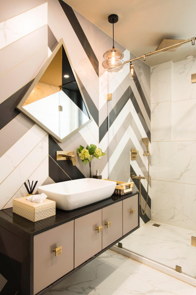 Photo of a contemporary bathroom in Delhi with flat-panel cabinets, grey cabinets, an alcove shower, multi-coloured tile, a vessel sink, white floor and black benchtops.