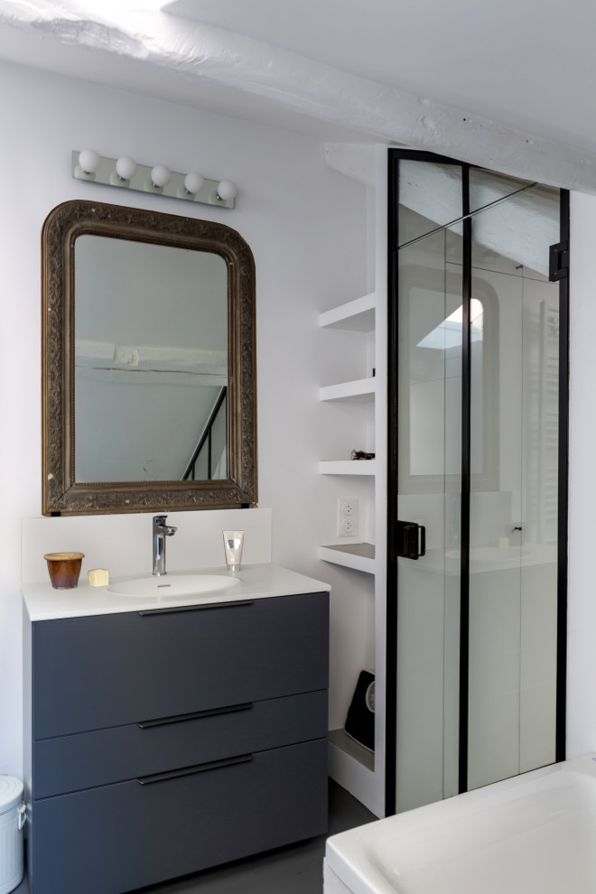 Design ideas for a small industrial master bathroom in Paris with grey cabinets, white tile, ceramic tile, white walls, concrete floors, solid surface benchtops, grey floor, white benchtops, a niche, a single vanity, a freestanding vanity, flat-panel cabinets and a drop-in sink.