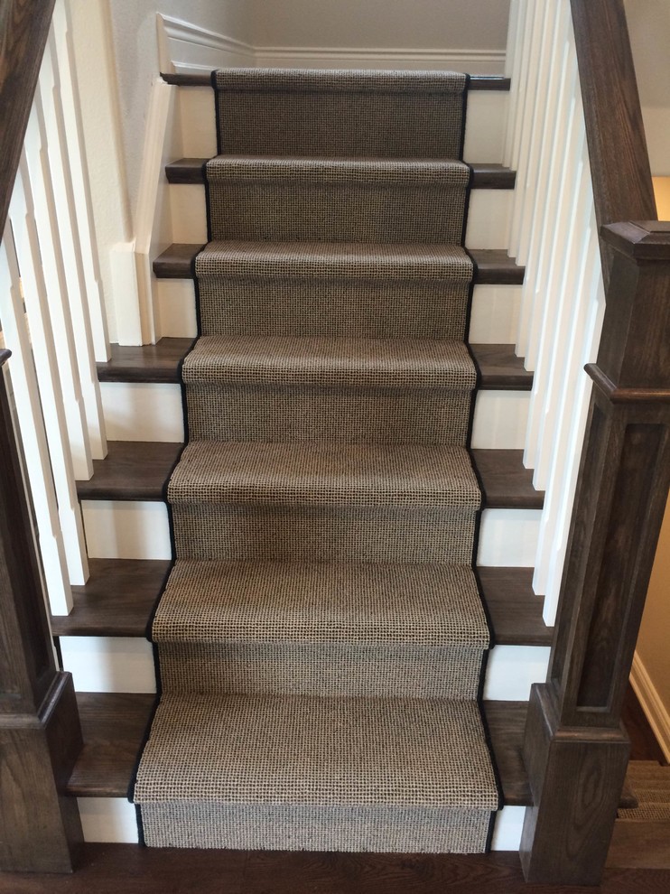 Example of a transitional carpeted staircase design in Toronto with carpeted risers