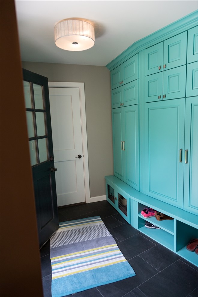 Inspiration for a mid-sized transitional slate floor mudroom remodel in Wichita with gray walls and a dark wood front door