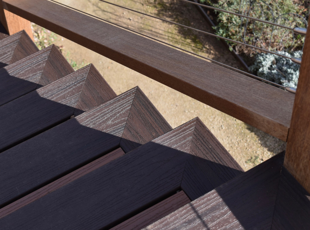 Minimalist backyard second story cable railing deck photo