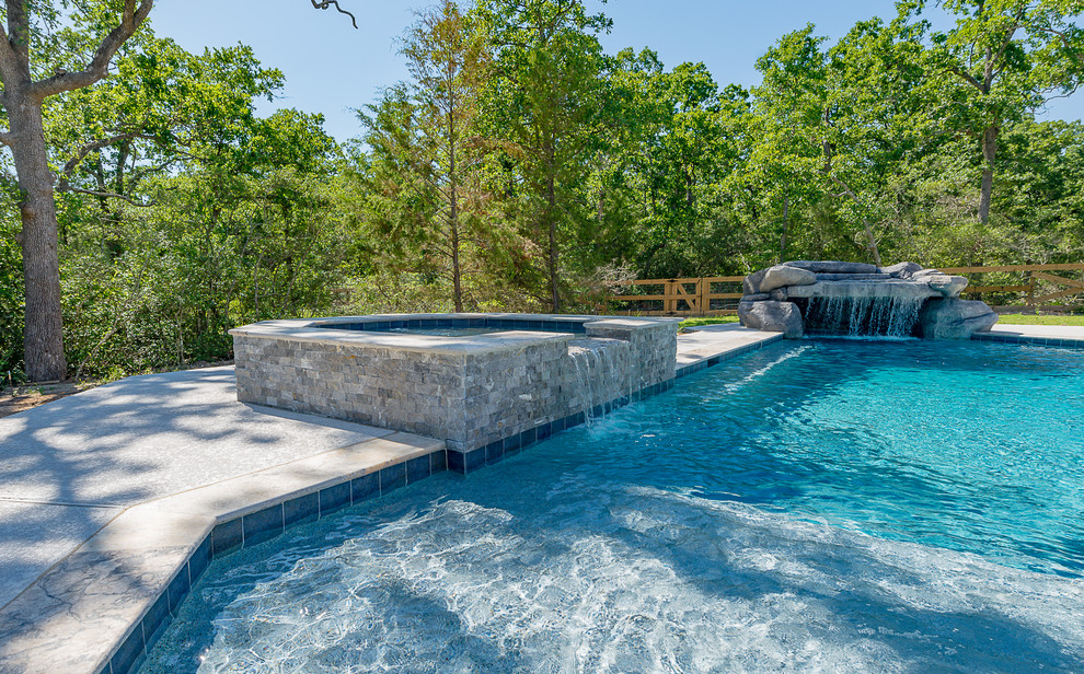 Inspiration for a large modern backyard custom-shaped pool in Other with a hot tub and concrete slab.