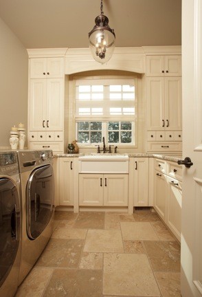 Design ideas for a traditional laundry room in Calgary.