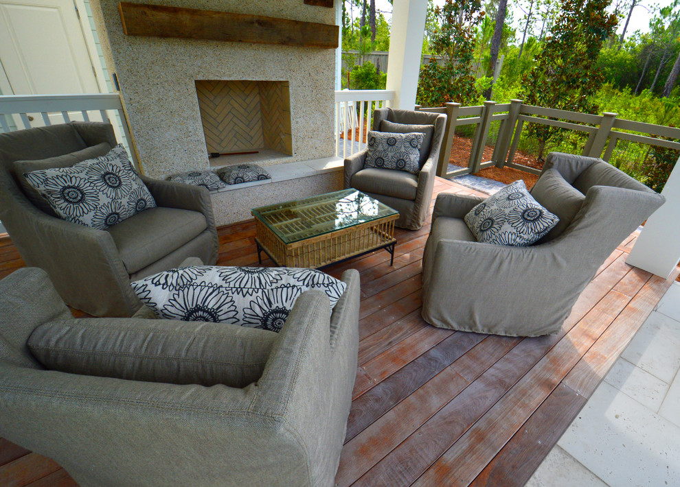 Deck - large coastal backyard deck idea in Miami with a fire pit and a roof extension