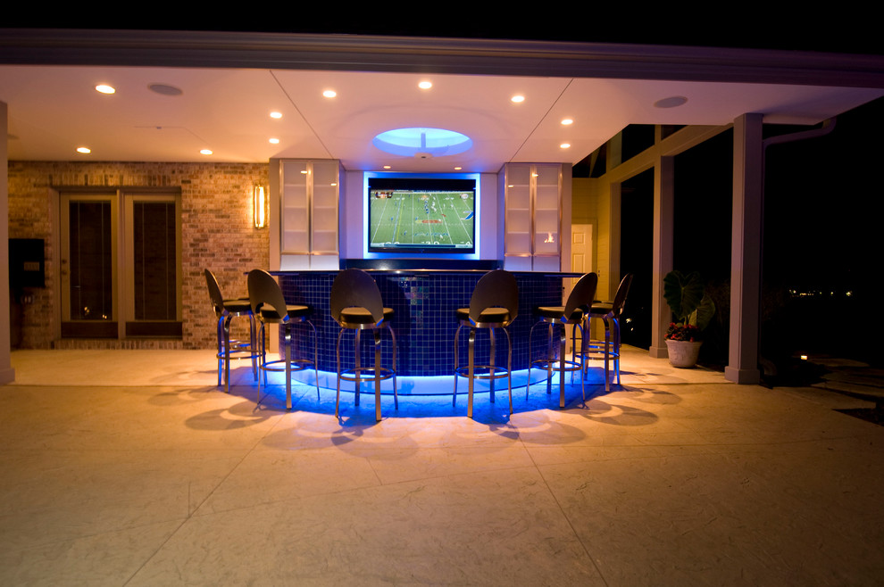 Inspiration for a large transitional backyard concrete paver and rectangular natural hot tub remodel in Cedar Rapids