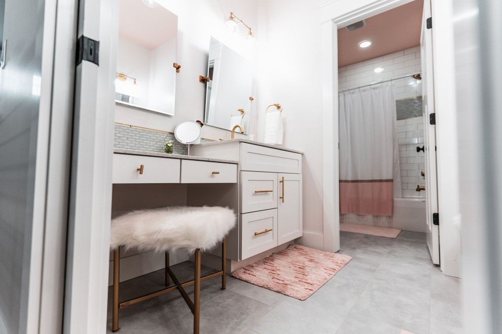 Photo of a mid-sized transitional kids bathroom in Other with flat-panel cabinets, white cabinets, multi-coloured tile, glass tile, an integrated sink, marble benchtops, grey floor, multi-coloured benchtops, a single vanity and a built-in vanity.