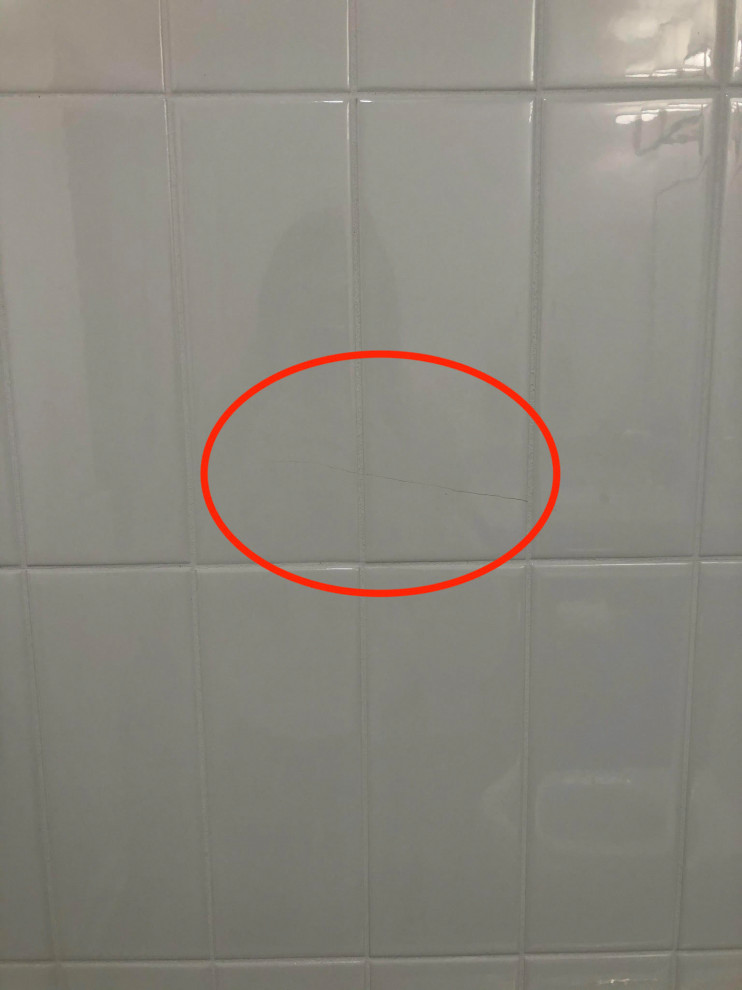 Tiles on the bathroom wall keep cracking