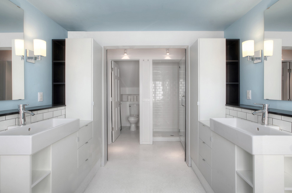 Inspiration for a mid-sized transitional master bathroom in Indianapolis with a console sink, flat-panel cabinets, white cabinets, laminate benchtops, a drop-in tub, an alcove shower, a two-piece toilet, white tile, ceramic tile, white walls and ceramic floors.