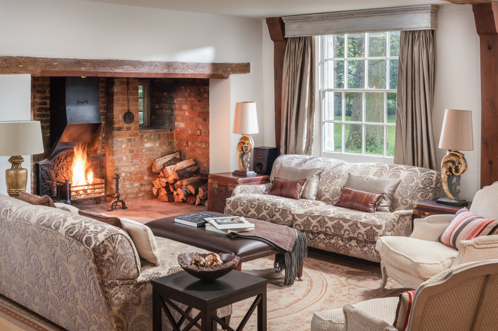 Photo of a rural formal enclosed living room in Essex with white walls, a standard fireplace and a brick fireplace surround.