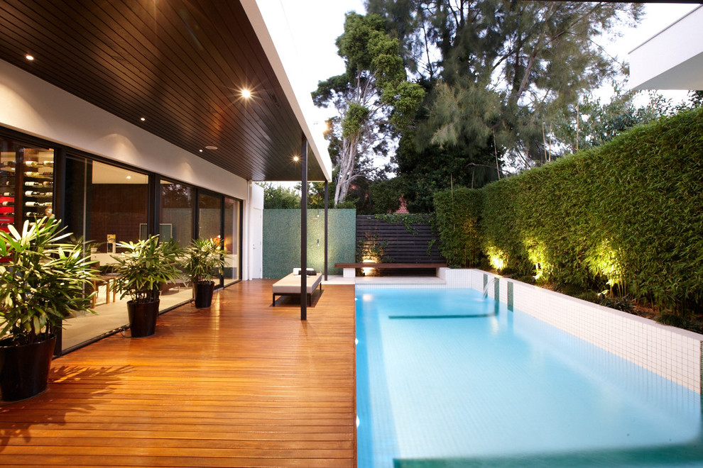 Design ideas for a contemporary lap pool in Melbourne with decking.