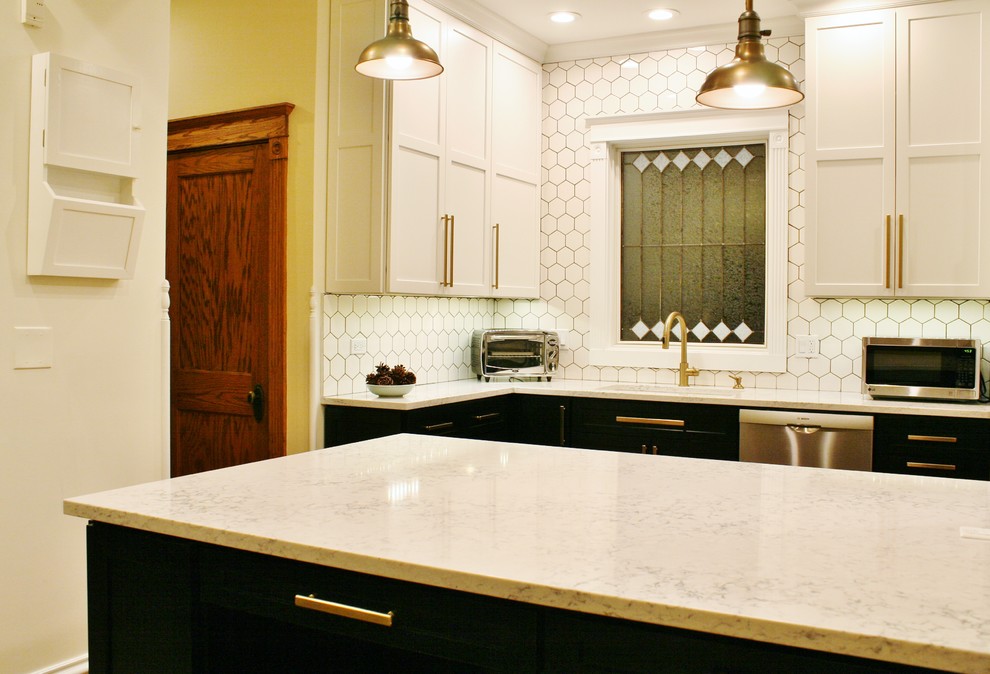 Inspiration for a small transitional galley medium tone wood floor and brown floor eat-in kitchen remodel in Chicago with an undermount sink, shaker cabinets, white cabinets, quartz countertops, white backsplash, porcelain backsplash, stainless steel appliances and an island