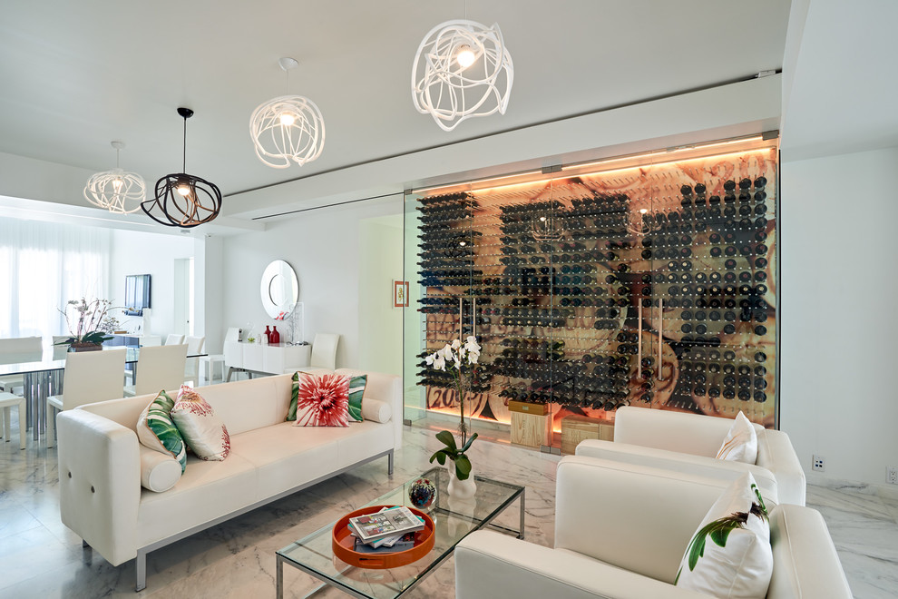 This is an example of a contemporary open concept living room in Miami with white walls.