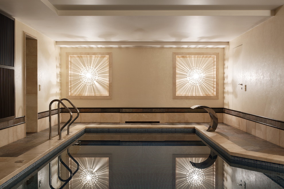 Design ideas for a large eclectic indoor custom-shaped pool in Moscow with a water feature.