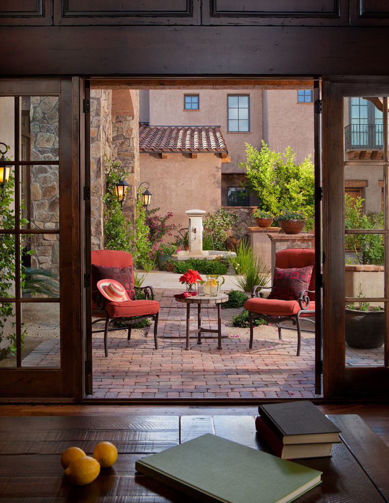 Inspiration for a mediterranean backyard patio in Phoenix.