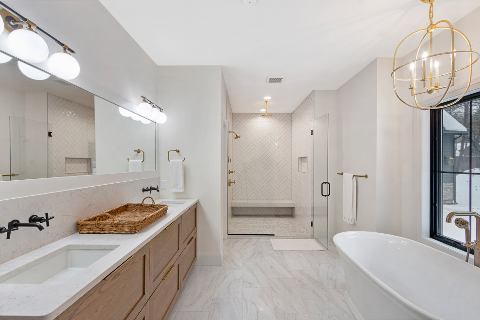 This is an example of a country master bathroom in Other with raised-panel cabinets, a freestanding tub, a curbless shower, white tile, porcelain tile, white walls, porcelain floors, a drop-in sink, marble benchtops, white floor, a hinged shower door, a double vanity and a built-in vanity.