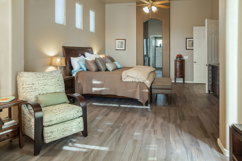 Inspiration for a transitional master porcelain tile bedroom remodel in Phoenix with beige walls