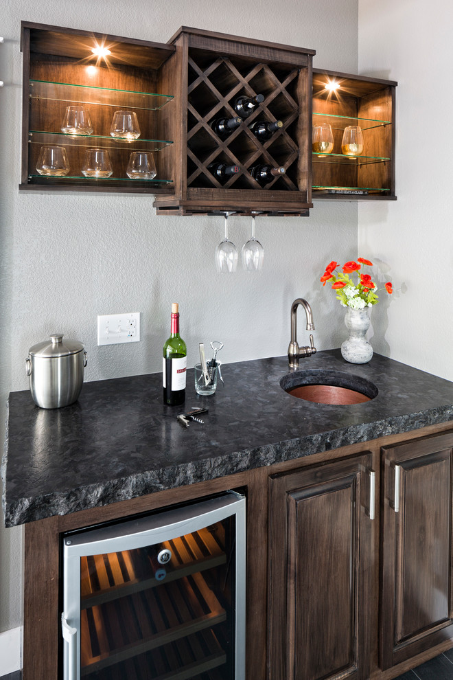 Home bar - mid-sized rustic walk-out carpeted and beige floor home bar idea in Denver with gray walls