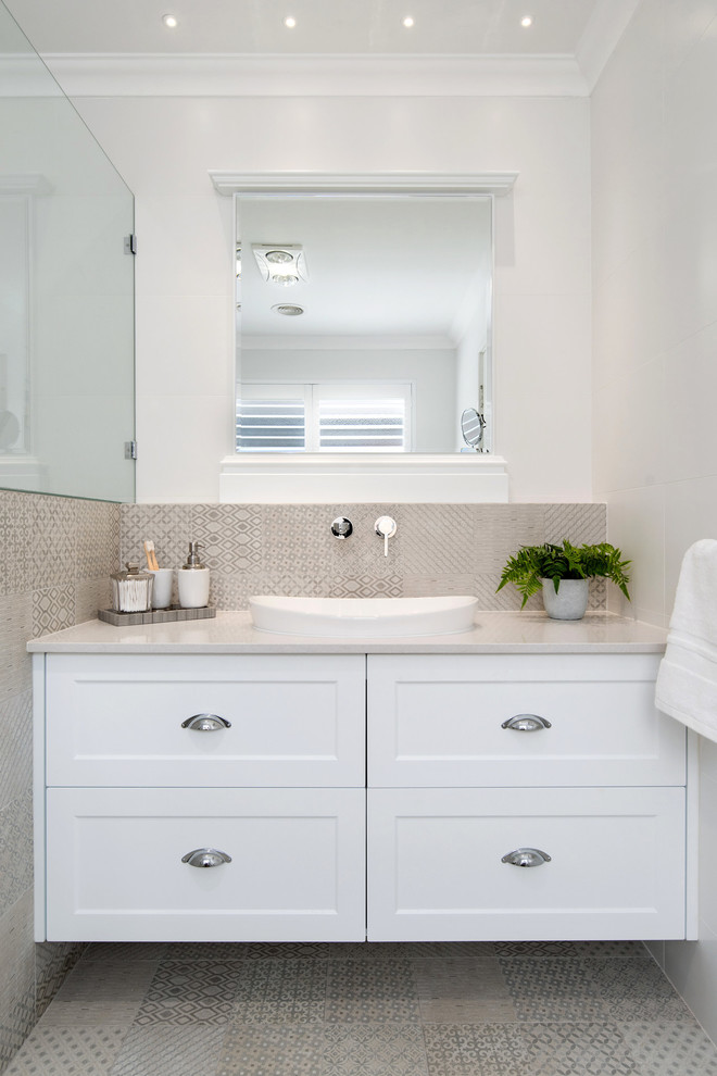This is an example of a transitional bathroom in Perth with shaker cabinets, white cabinets, beige tile, cement tile, white walls, cement tiles, beige floor, beige benchtops and a vessel sink.