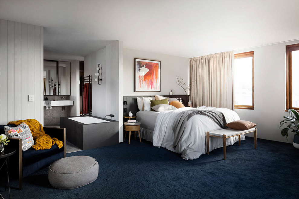 Design ideas for a large contemporary master bedroom in Melbourne with grey walls, carpet, no fireplace and blue floor.
