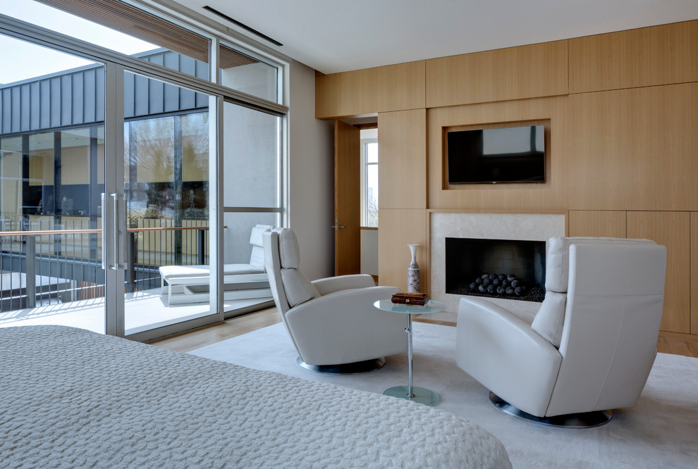 This is an example of a contemporary bedroom in Dallas with a standard fireplace.
