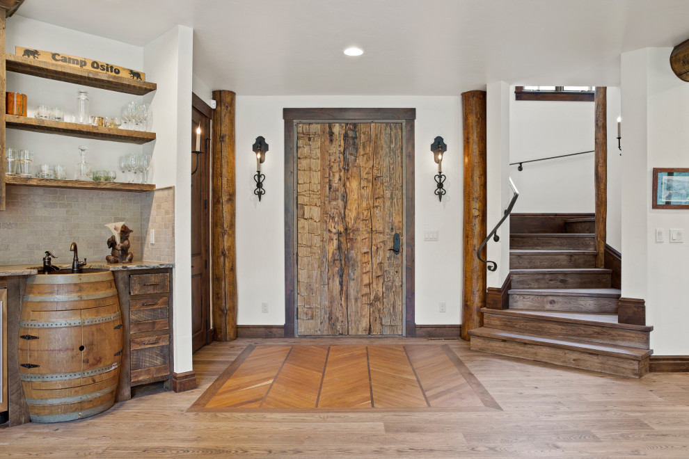 Mountain style front door photo with a medium wood front door