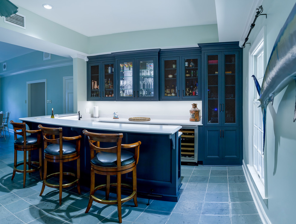 Traditional home bar in Other with recessed-panel cabinets, blue cabinets, quartz benchtops, white splashback, ceramic floors, grey floor and white benchtop.