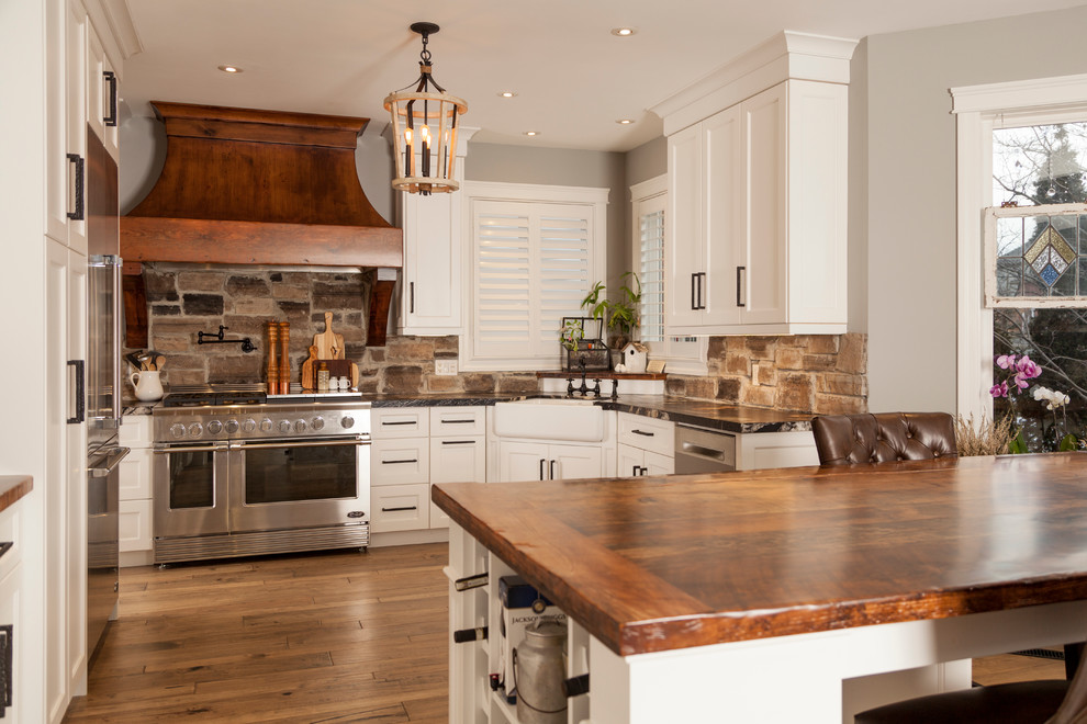 Example of a transitional kitchen design in Toronto