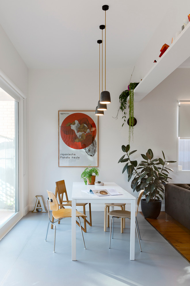This is an example of a small scandinavian kitchen/dining combo in Melbourne with white walls, linoleum floors and no fireplace.
