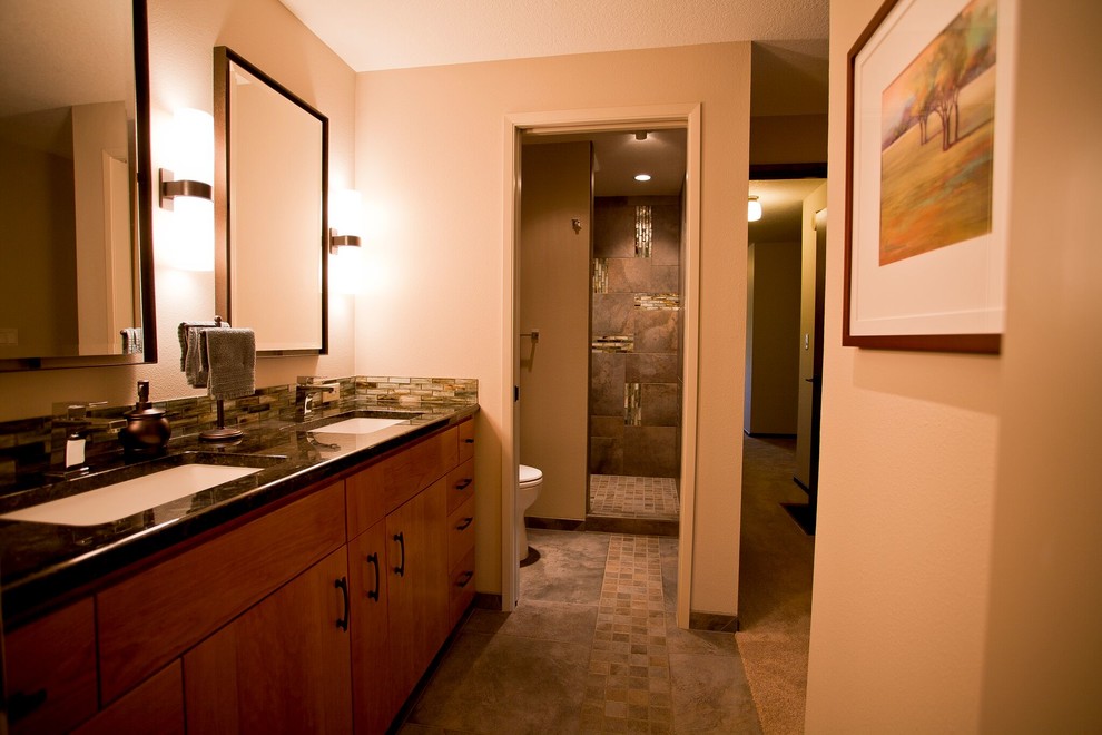 This is an example of a mid-sized asian master bathroom in Portland with flat-panel cabinets, brown cabinets, an alcove shower, a two-piece toilet, brown tile, porcelain tile, orange walls, porcelain floors, an undermount sink, granite benchtops, multi-coloured floor, an open shower and multi-coloured benchtops.